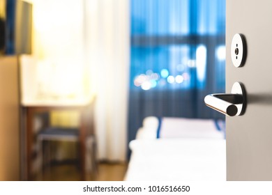 Hotel Room Door Open. Clean And Elegant Accommodation Service. Close Up Of Handle. Bed, Table And Tv. Travel, Lodging And Motel Concept.