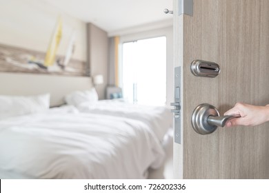 Hotel Room Door Opened Unlock To Guest Bedroom Interior View With Blur Background Of Modern Comfort Bed Luxury High Quality Living Space For Traveler  