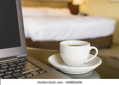 Hotel Room With Laptop And Cup Of Coffee