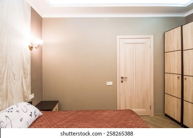 Hotel Room. Small Bedroom With Double Bed. Modern Interior Room