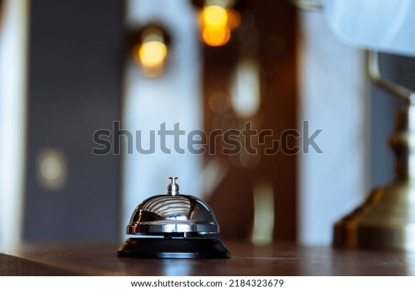 Hotel service bell on a table in hotel.\
Concept of hotel or\
restaurant