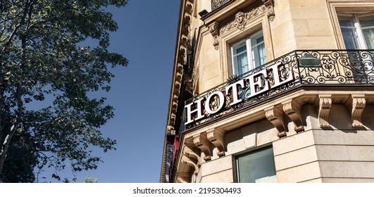 Hotel Sign On Building Facade In City, Travel And Accommodation Concept