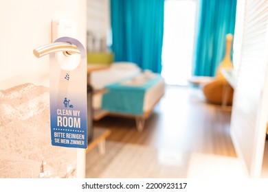 Hotel Suit With Label On A Door Handle. Door Of Hotel Room With ''clean My Room'' Sign. Closed Door Of Hotel Room With Please Make Up The Room Sign.