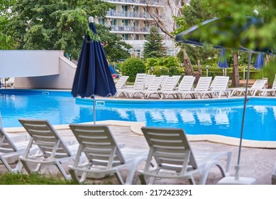 Hotel Swimming Pool Umbrella And Chairs, No People