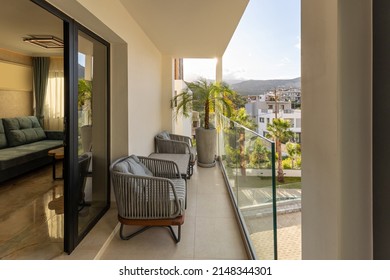 Hotel terrace with plants and glass fence - Shutterstock ID 2148344301