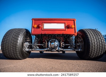 Hotrod from behind with huge wheels