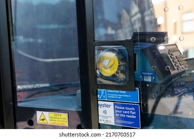 Hounslow, UK  June 22nd 2022  A London Bus Customer Tap And Go Pay Terminal And Signage Covered By A Dirty Plastic Screen At The Front Of The Bus By The Drivers Cockpit