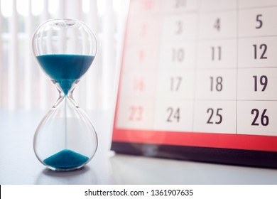 Hour glass and calendar concept for time slipping away for important appointment date, schedule and deadline - Shutterstock ID 1361907635