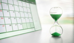 Hour Glass And Green Calendar Concept For Time Slipping Away For Important Appointment Date, Schedule And Deadline
