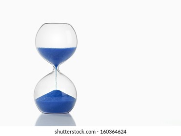 Hourglass with Blue Sand on White Background