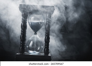 Hourglass clock on black background