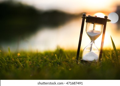 Hourglass in the dawn time - Shutterstock ID 471687491