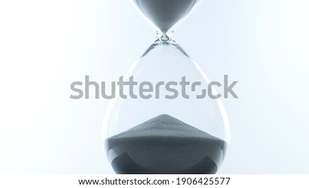 Hourglass in a glass jar on white background, Time concept.