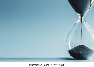 Hourglass On Blue Background