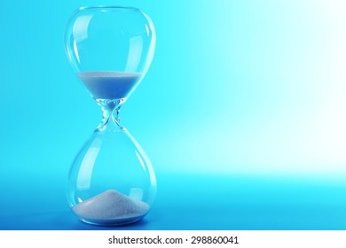 Hourglass on blue background - Shutterstock ID 298860041