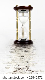 hourglass reflecting in the water