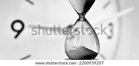 hourglass and round clock measuring time
