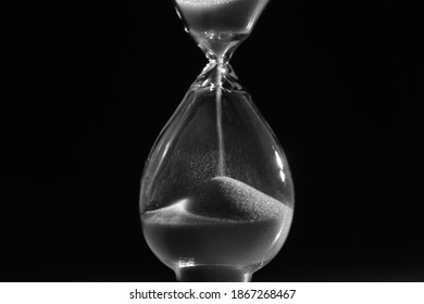 Hourglass. Sands Move Through Hour Glass. Close Up.