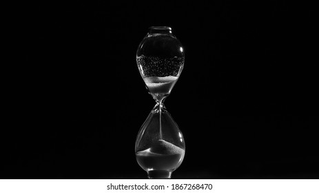 Hourglass. Sands Move Through Hour Glass. Close Up.