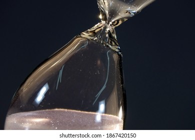 Hourglass. Sands Move Through Hour Glass. Close Up.