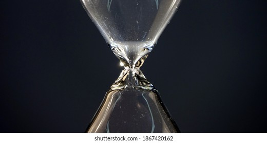 Hourglass. Sands Move Through Hour Glass. Close Up.