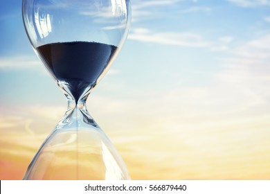 Hourglass at sunset with copy space