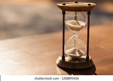 Hourglass as time passing concept for business deadline, urgency and running out of time.
