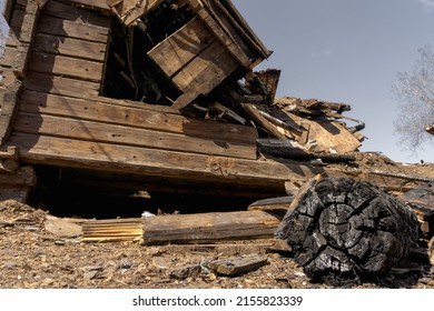 House After The Fire. Destroyed Charred Dwelling. Broken Door Windows.