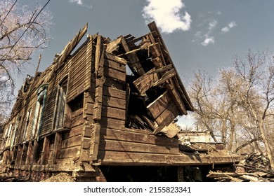 House After The Fire. Destroyed Charred Dwelling. Broken Door Windows.