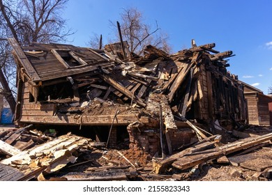 House After The Fire. Destroyed Charred Dwelling. Broken Door Windows.