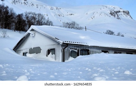 House Almost Buried In Snow.