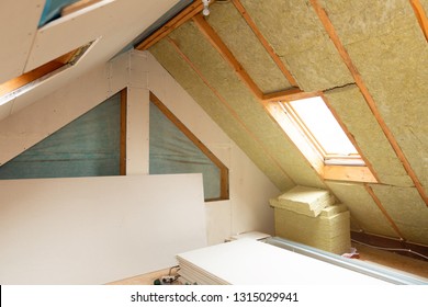 House Attic Insulation And Renovation. Drywall Construction