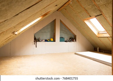 house attic under construction mansard wall insulation with rock wool
