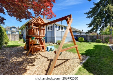 House Backyard With Lawn And Playground For Kids