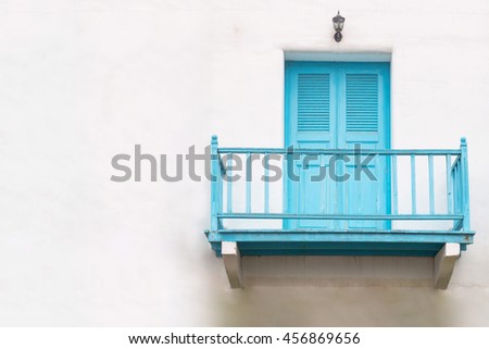 House with balconies and balcony railings with doors
