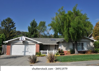 House With Basketball Hoop Above Garage