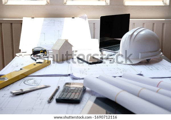 house blueprint of real\
estate project at architect engineer  workplace. building and\
construction concept