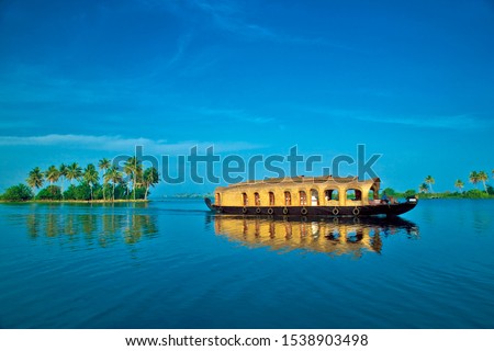 House boat under blue sky from Alleppey or AlappuzhaKerala.Kerala Backwaters, houseboat Photo