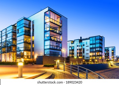 House building and city construction concept: evening outdoor urban view of modern real estate homes - Shutterstock ID 189023420