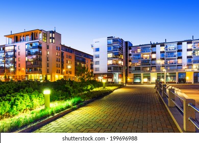 House building and city construction concept: evening outdoor urban view of modern real estate homes
