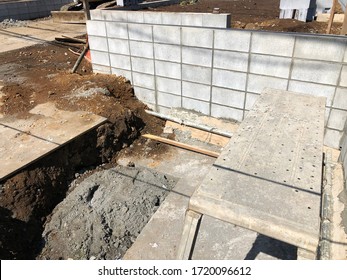 House building construction site, foundation and cement block wall working on land. Housing structure style of Japan.