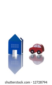 A House And Car Toy Isolated On White With Reflection