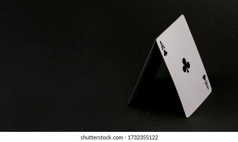 House Of Cards Isolated On Black. Ace Cross On A Black Background