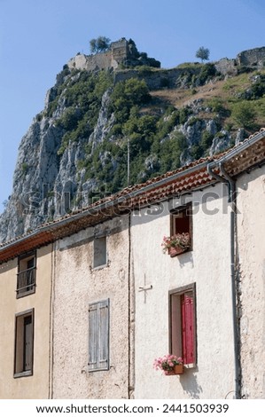 House and Cathar castle, Roquefixade, Ariege, Midi-Pyrenees, France, Europe