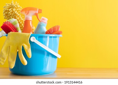 House cleaning product on wood table with yellow background, home service or housekeeping concept - Powered by Shutterstock