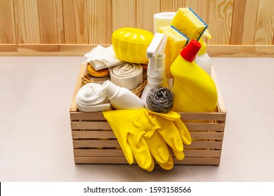 House Cleaning Product In Wooden Box. Spray, Bottle, Gloves, Dishwashing Sponge, Scraper, Gel Air Freshener. Stone Concrete Background, Copy Space