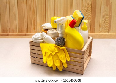 House Cleaning Product In Wooden Box. Spray, Bottle, Gloves, Dishwashing Sponge, Scraper, Gel Air Freshener. Stone Concrete Background, Copy Space