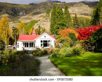 House With Colorful Trees And Flowers Scene Of Walter Peak High Country Farm, New Zealand  