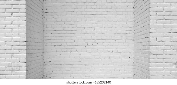 House Corner, Brick Wall Painted With White Paint.