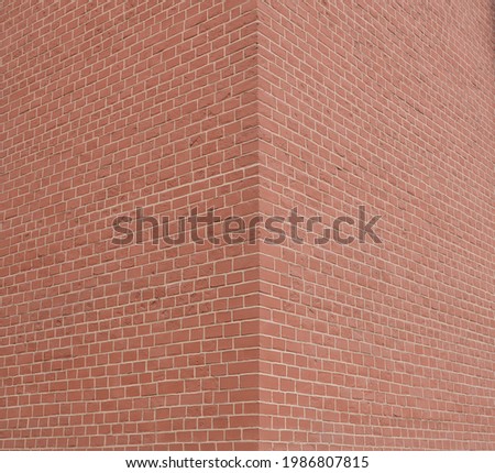 House corner, Brick wall painted with red paint.